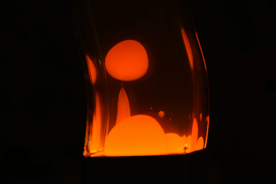 A Lava Lamp glowing as its wax warms, showcasing the 45-minute science behind its wake-up spectacle.